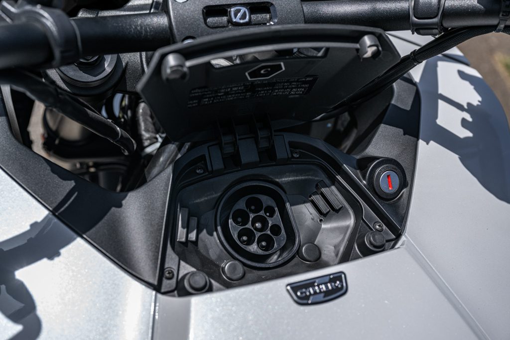 Zero DSR/X 17.3 – The Californian Adventurer 3 Unprotected type 2 charging port behind the steering head. Well …